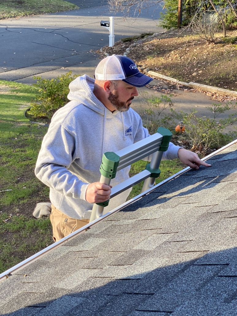 Jon Sady, owner and lead inspector of Sady Home Inspection inspecting a roof.